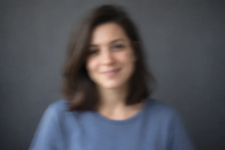 Out-of-focus portrait with blurred facial details.
